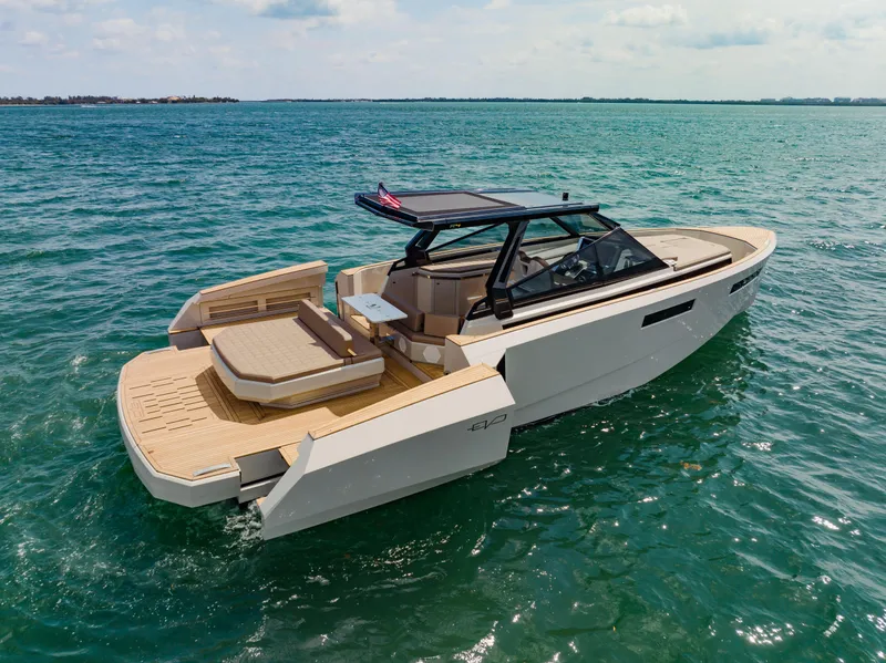 Slide: The Image of 2024 Evo Yachts R4 WA luxury motor yacht cruising on open water. - 12