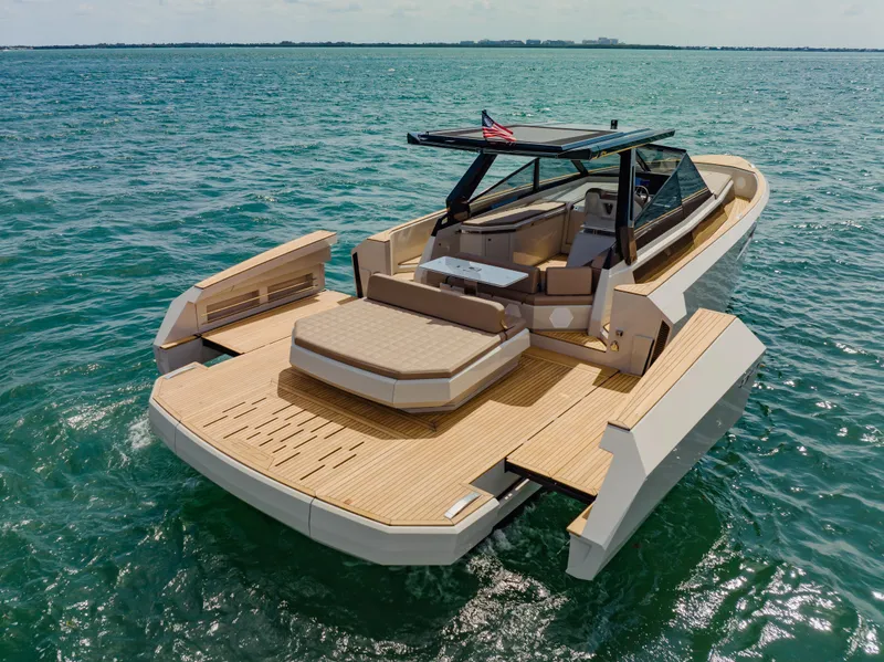 Slide: The Image of 2024 Evo Yachts R4 WA luxury yacht on open water. - 13