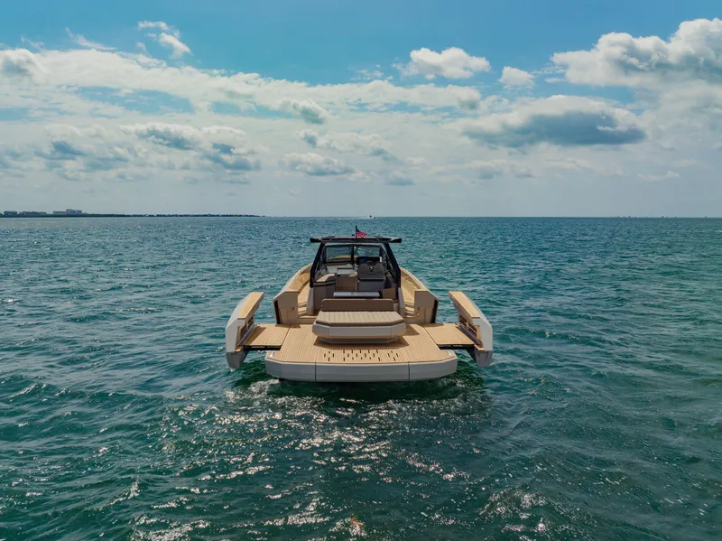 Slide: The Image of 2024 Evo Yachts R4 WA luxury yacht on open water. - 14