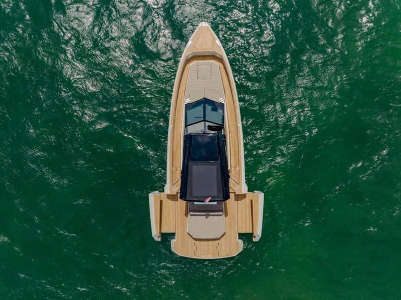 Slide: The Image of Top view of 2024 Evo Yachts R4 WA on green water. - 15