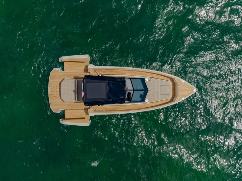 Slide: The Image of Aerial view of 2024 Evo Yachts R4 WA on open water. - 16