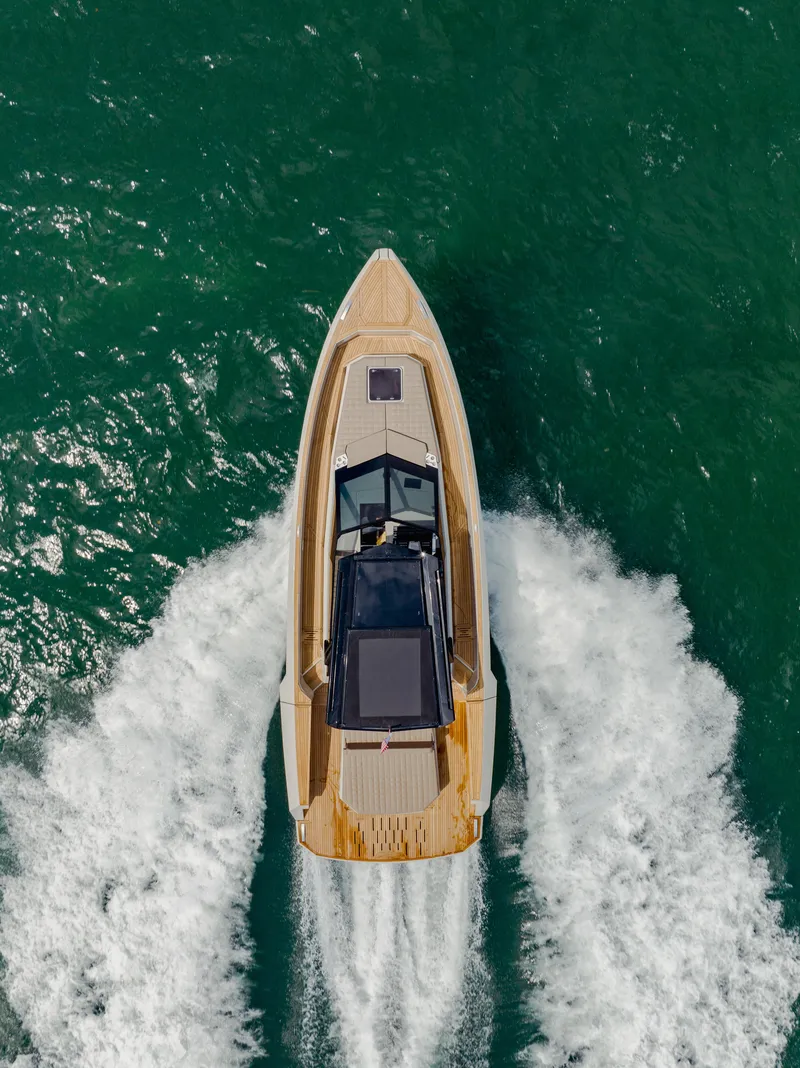 Slide: The Image of Aerial view of 2024 Evo Yachts R4 WA cruising on the water. - 24