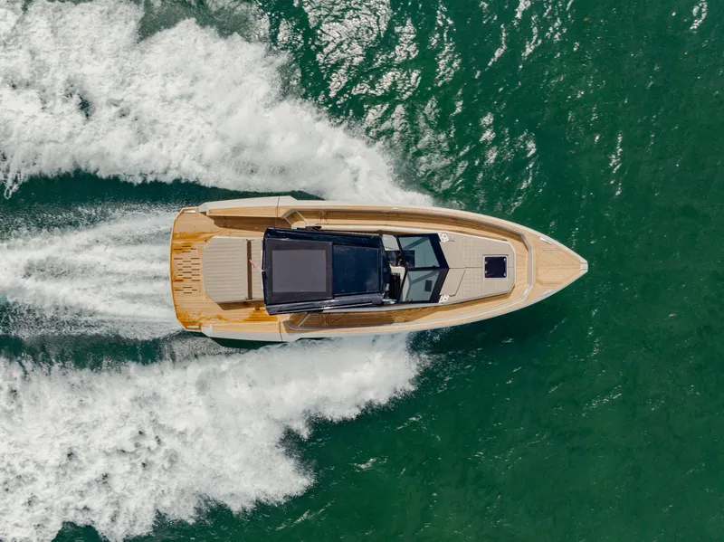 Slide: The Image of Aerial view of 2024 Evo Yachts R4 WA cruising on the water. - 25
