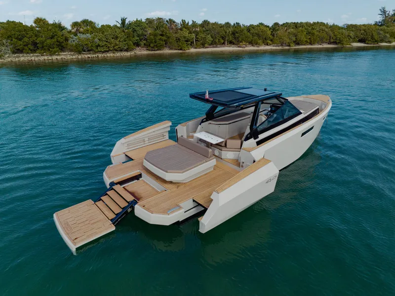 Slide: The Image of 2024 Evo Yachts R4 WA luxury yacht on serene water. - 29