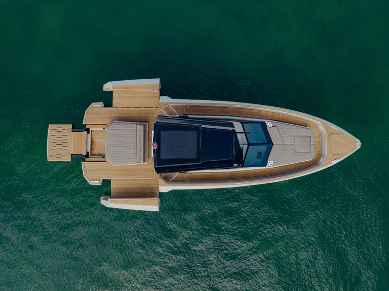 Slide: The Image of Aerial view of 2024 Evo Yachts R4 WA luxury yacht on clear green water. - 31