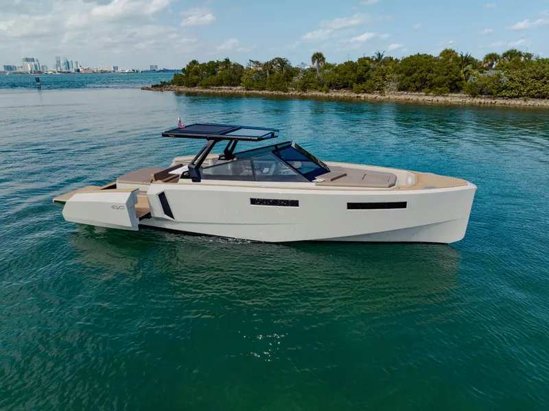 Slide: The Image of 2024 Evo Yachts R4 WA luxury motor yacht cruising in clear blue waters. - 32