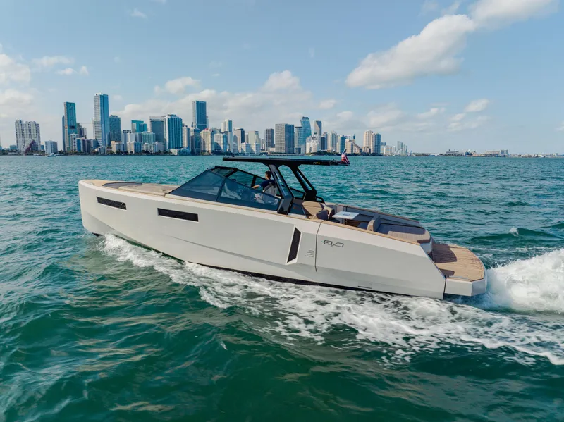 Slide: The Image of 2024 Evo Yachts R4 WA cruising near a city skyline. - 35