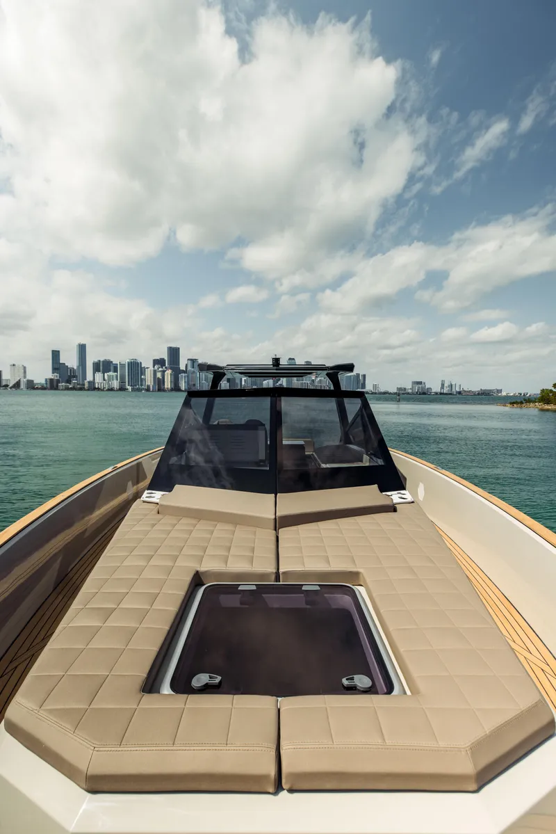 Slide: The Image of 2024 Evo Yachts R4 WA luxury yacht with city skyline in the background. - 40