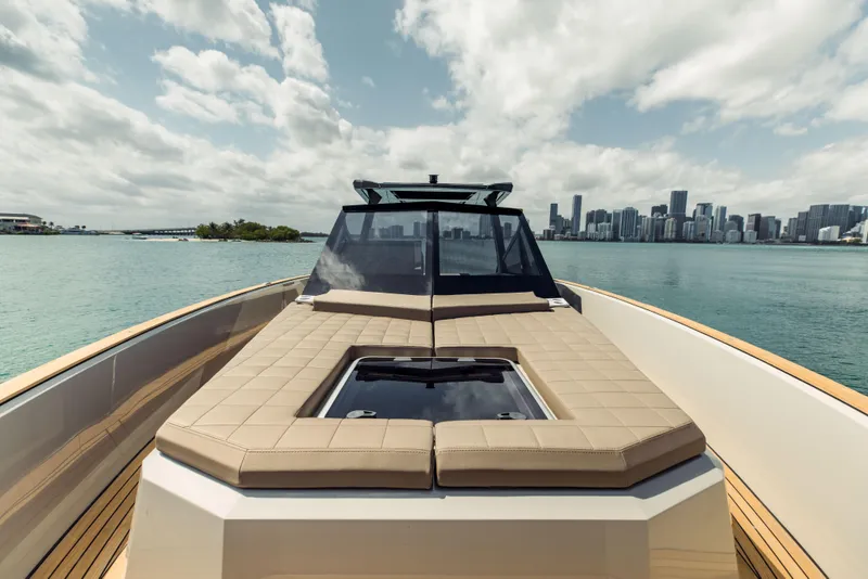 Slide: The Image of 2024 Evo Yachts R4 WA luxury yacht with city skyline in the background. - 41