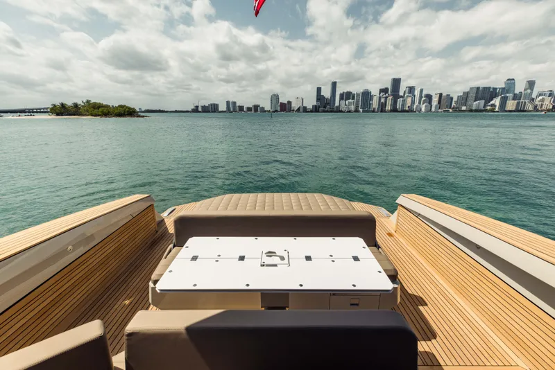 Slide: The Image of 2024 Evo Yachts R4 WA luxury yacht with city skyline view. - 46
