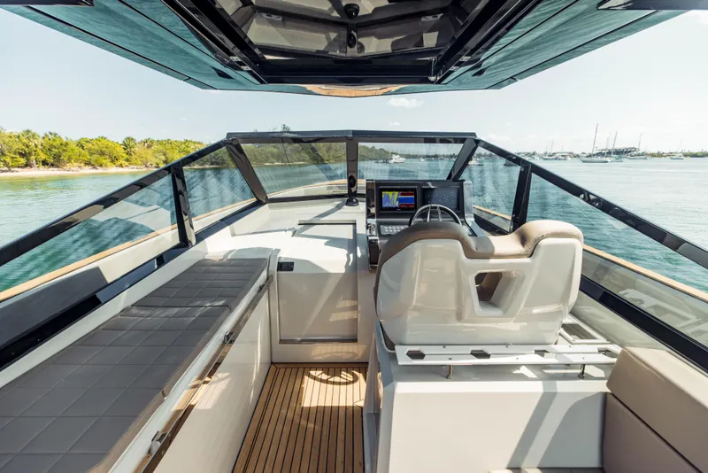 Slide: The Image of 2024 Evo Yachts R4 WA cockpit with modern helm and seating. - 47