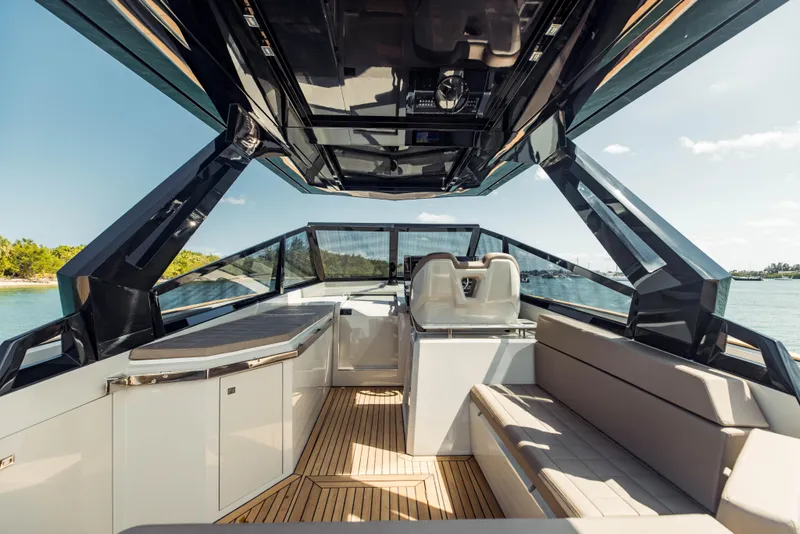 Slide: The Image of 2024 Evo Yachts R4 WA interior with modern seating and sleek design. - 49