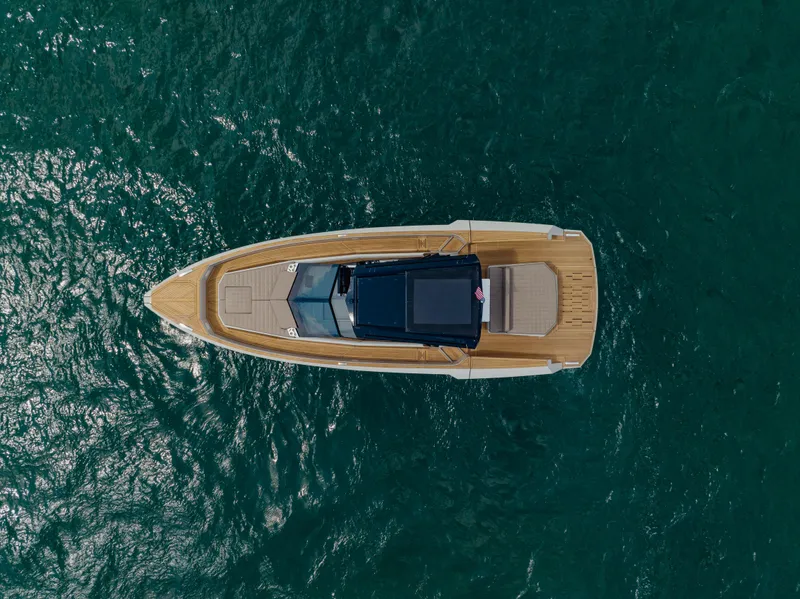Slide: The Image of Aerial view of 2024 Evo Yachts R4 WA luxury boat on open water. - 9