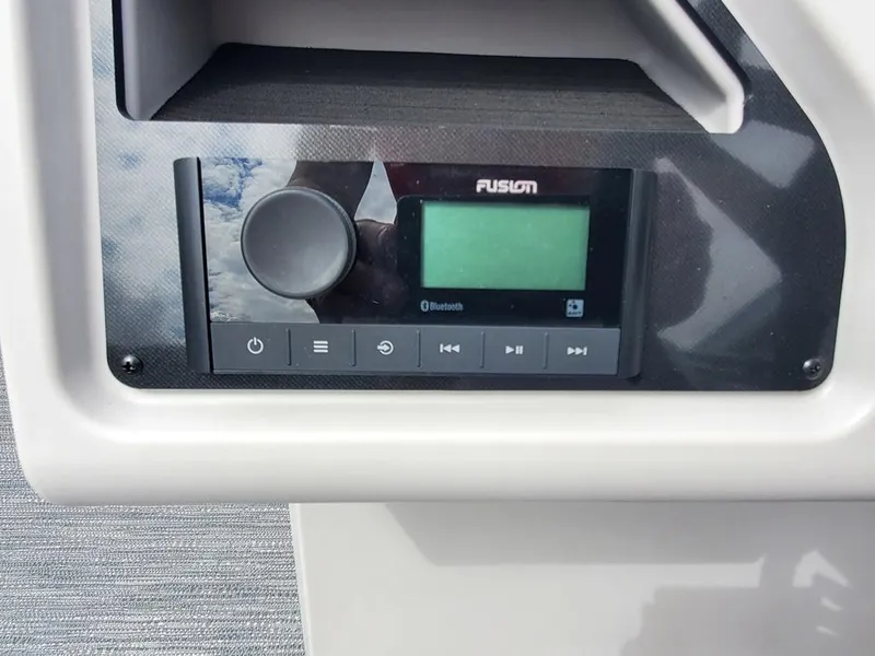 Slide: The Image of Fusion Bluetooth stereo system on Sweetwater 2086 C boat, 2023 model. - 13