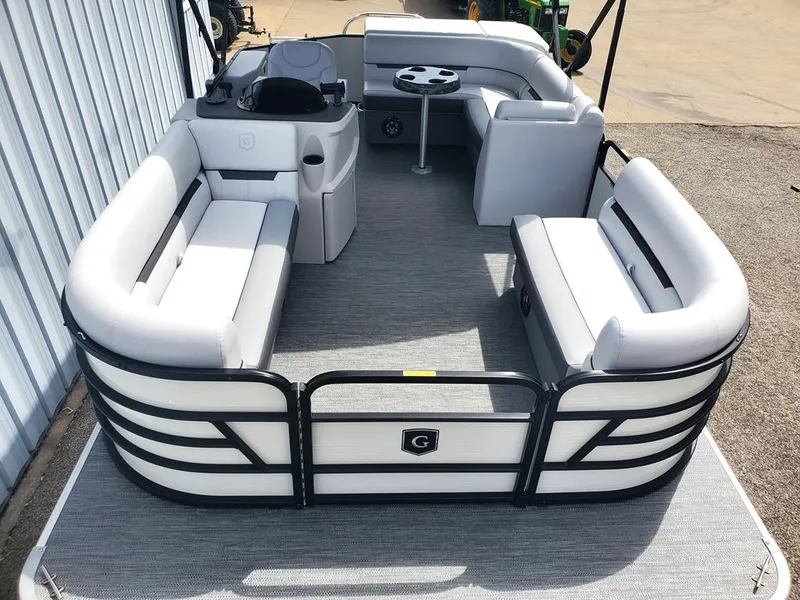 Slide: The Image of 2023 Sweetwater 2086 C pontoon boat with spacious seating and modern design. - 2