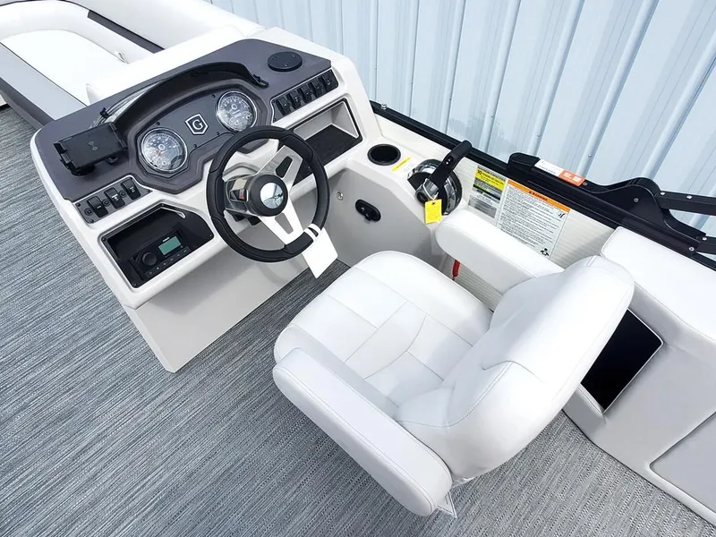 Slide: The Image of Sweetwater 2086 C 2023 boat cockpit with steering wheel and captain's chair. - 3