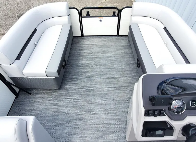 Slide: The Image of 2023 Sweetwater 2086 C pontoon boat interior with spacious seating and modern dashboard. - 4