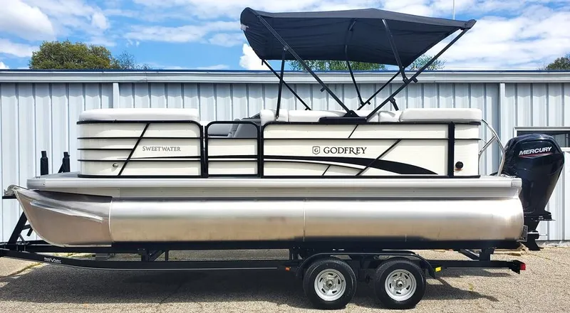 Slide: The Image of 2023 Sweetwater 2086 C pontoon boat by Godfrey with Mercury outboard motor. - 9