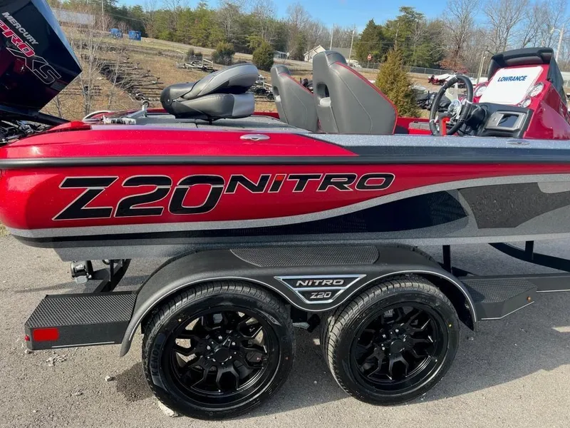Slide: The Image of 2023 Nitro Z20 Pro boat with dual axle trailer in red and black. - 10
