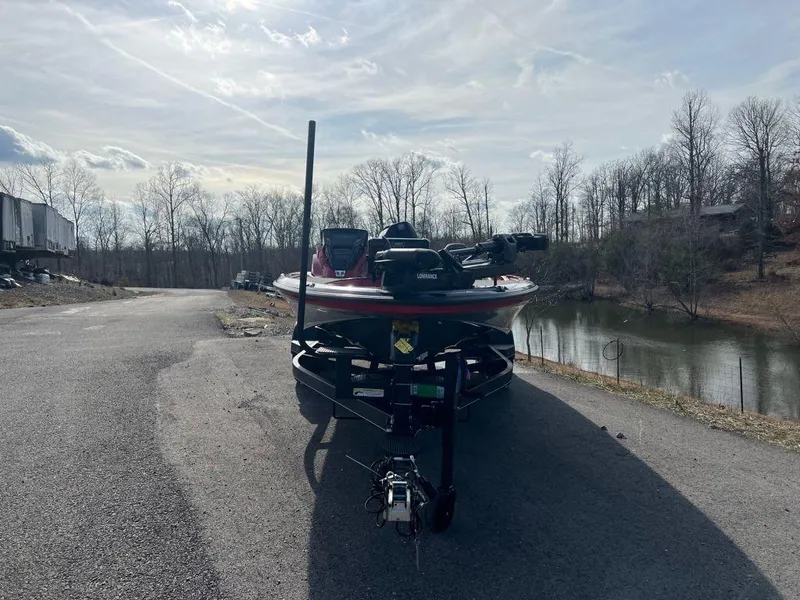 Slide: The Image of 2023 Nitro Z20 Pro boat on a trailer near a lake. - 4