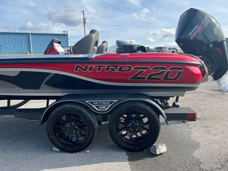 Slide: The Image of 2023 Nitro Z20 Pro boat with dual axle trailer and powerful outboard motor. - 5