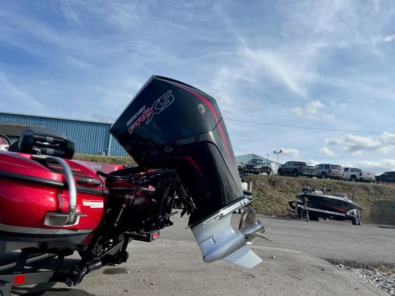 Slide: The Image of 2023 Nitro Z20 Pro boat with powerful outboard motor in a parking lot. - 7