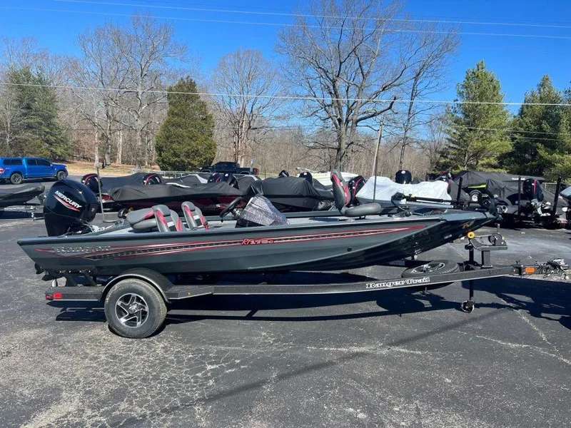 The Image of 2023 Ranger RT178C fishing boat on a trailer in a parking lot. - 1