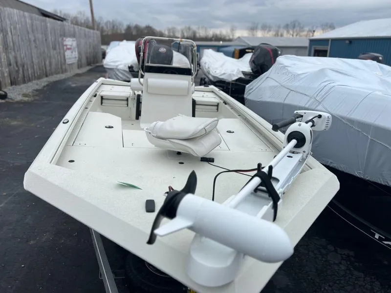 Slide: The Image of 2023 Ranger RB190 boat with trolling motor, parked outdoors. - 11