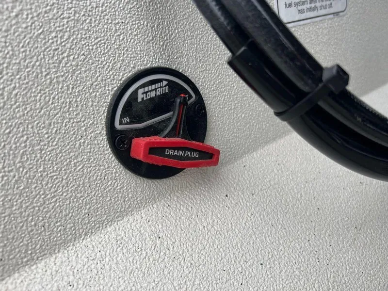 Slide: The Image of 2023 Ranger RB190 boat drain plug with Flow-Rite control. - 12