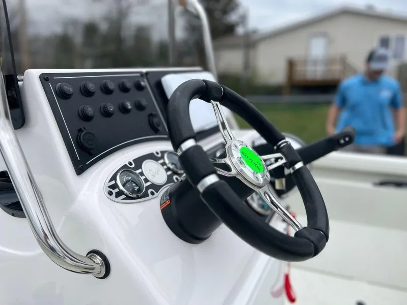 Slide: The Image of 2023 Ranger RB190 boat dashboard with steering wheel and control panel. - 9