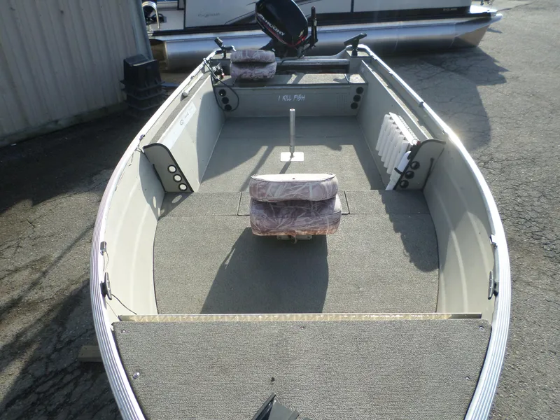 Slide: The Image of 1983 Sea Nymph 16 boat interior with seating and motor. - 2