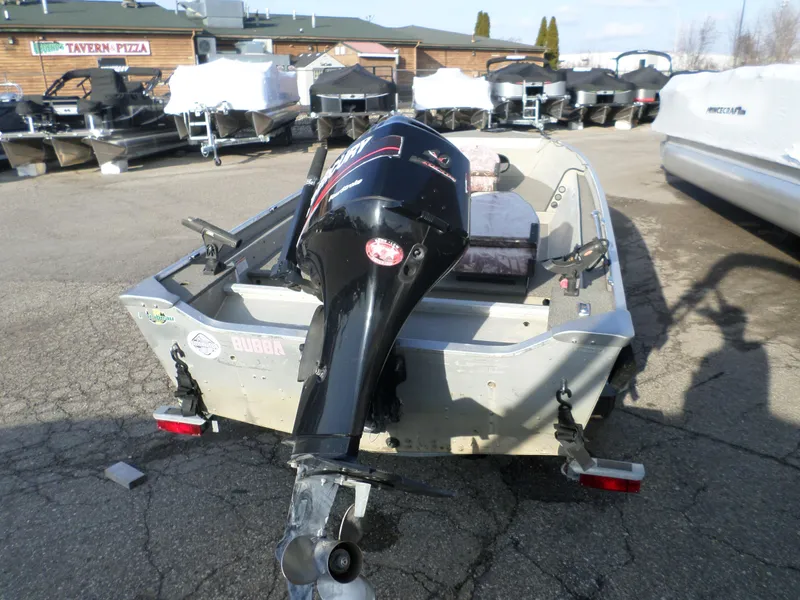Slide: The Image of 1983 Sea Nymph 16 boat with outboard motor in a marina. - 5