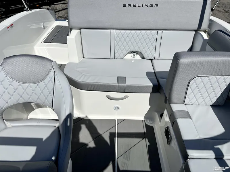 Slide: The Image of 2023 Bayliner DX2050 boat interior with gray seating and diamond stitching. - 3