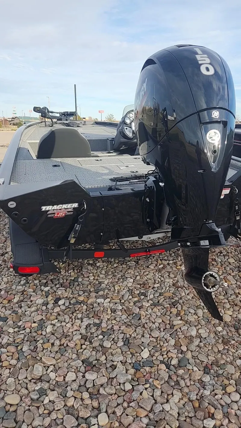 Slide: The Image of 2023 Tracker Pro Team 195 TXW Tournament Edition boat with outboard motor. - 2