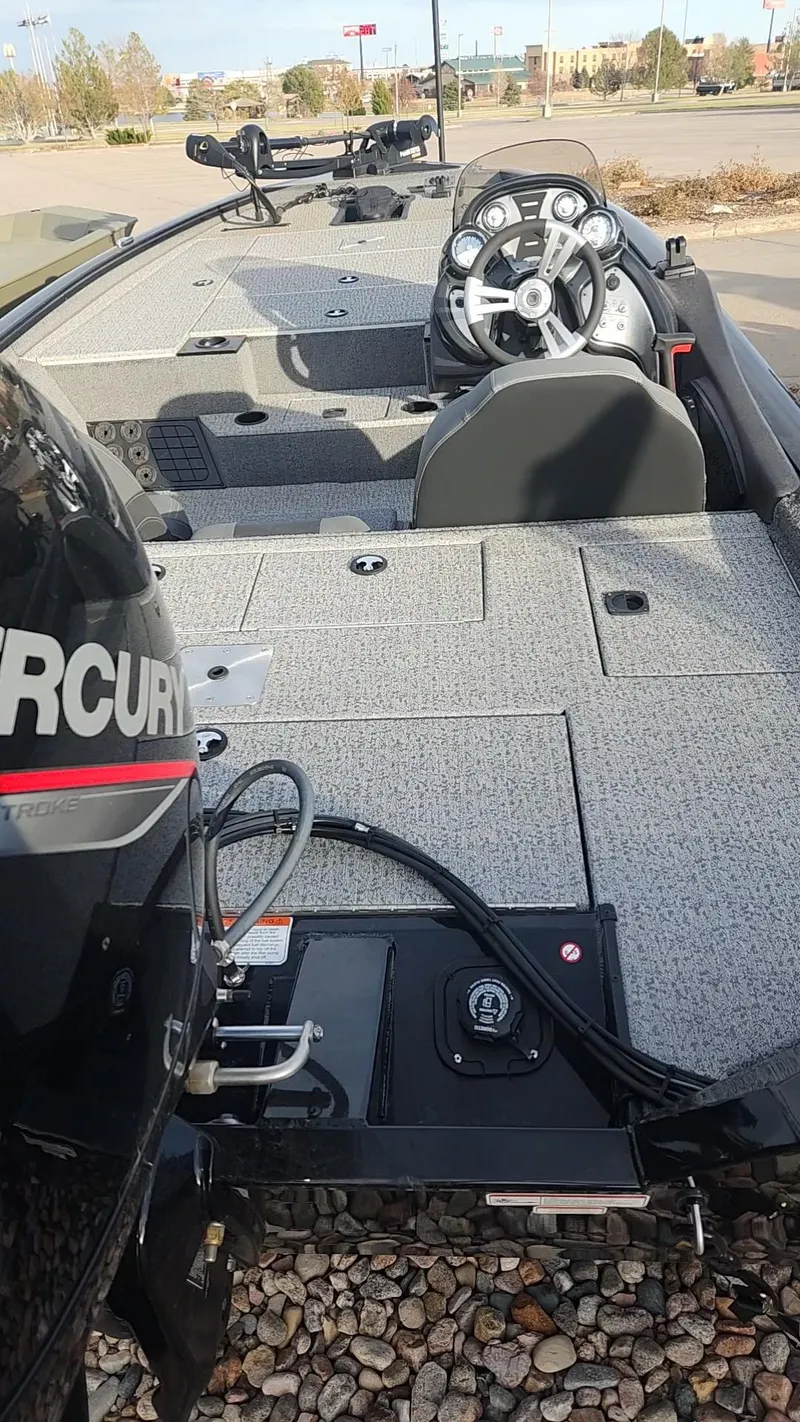 Slide: The Image of 2023 Tracker Pro Team 195 TXW Tournament Edition fishing boat interior with Mercury engine. - 4