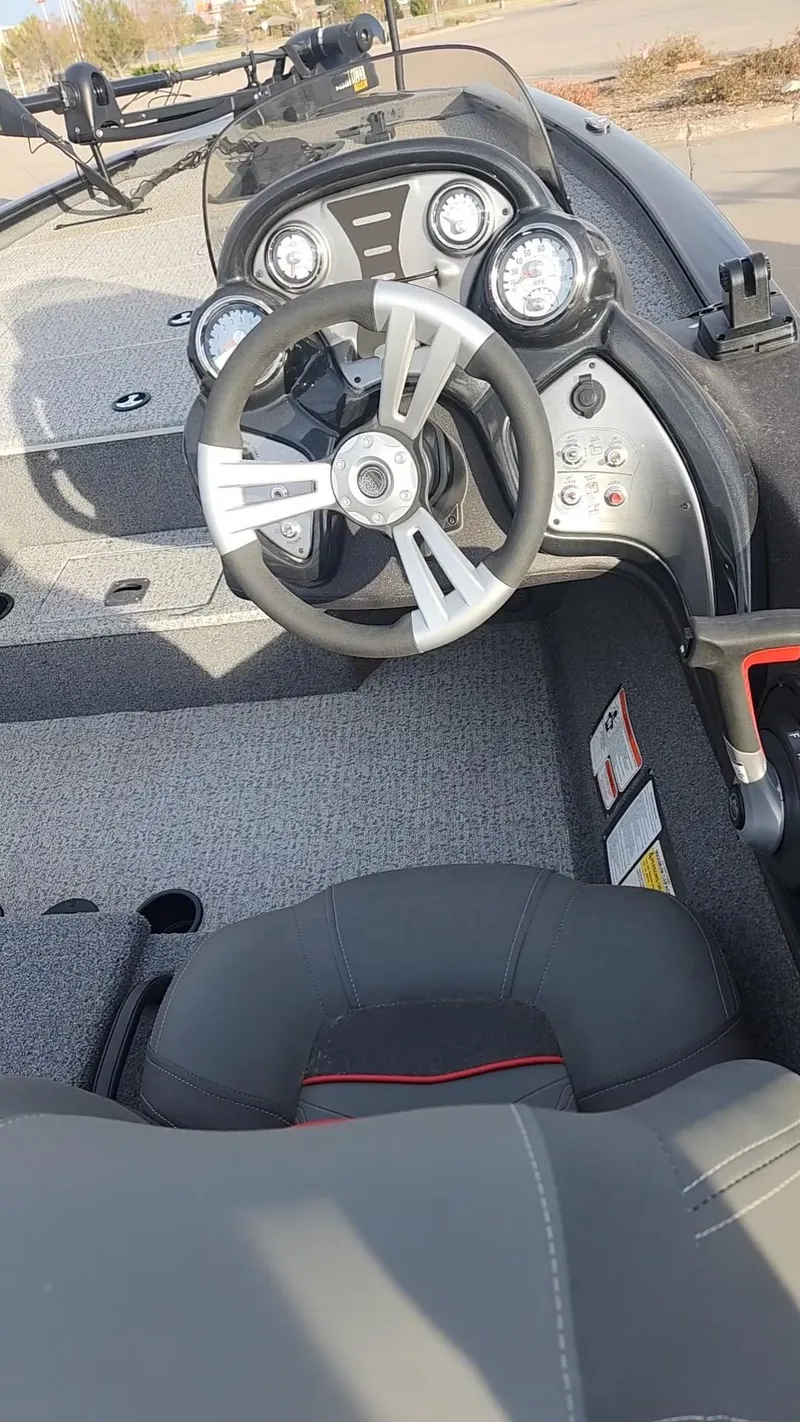 Slide: The Image of 2023 Tracker Pro Team 195 TXW Tournament Edition boat dashboard and steering wheel. - 6
