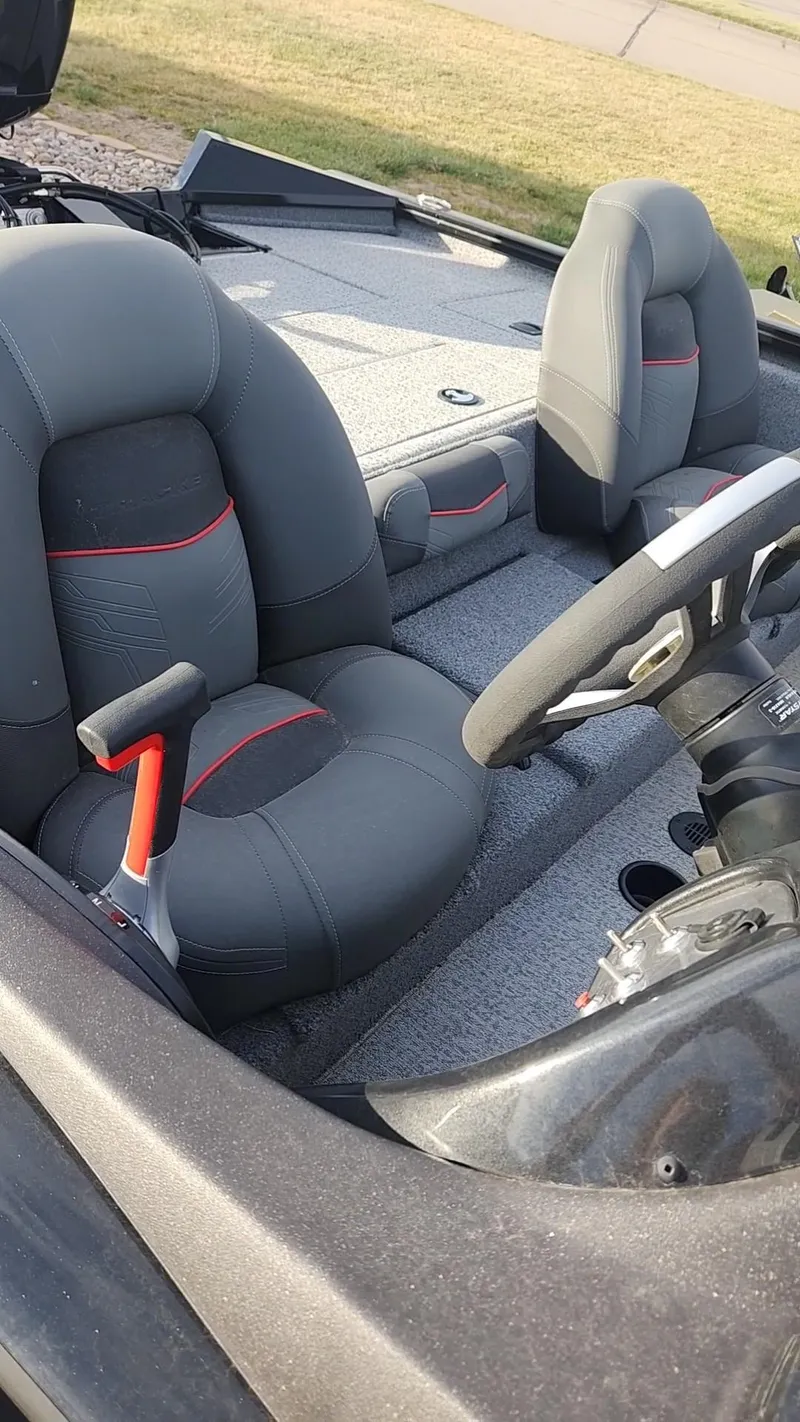 Slide: The Image of 2023 Tracker Pro Team 195 TXW Tournament Edition boat interior with gray seats. - 7