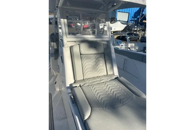Slide: The Image of 2023 Twin Vee 340 GFX CC boat interior with cushioned seating and modern design. - 2