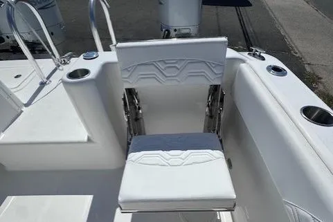 Slide: The Image of 2023 Twin Vee 280 GFX CC boat seat with cup holders and sleek design. - 23