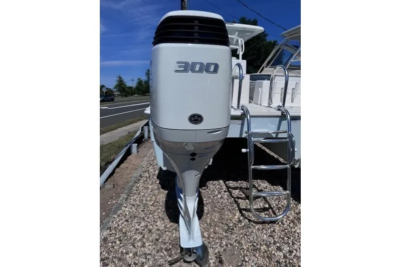 Slide: The Image of 2023 Twin Vee 280 GFX CC boat with 300 horsepower outboard motor and ladder. - 6