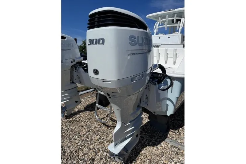 Slide: The Image of 2023 Twin Vee 280 GFX CC with Suzuki 300 outboard motor, displayed outdoors. - 7