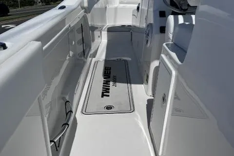 Slide: The Image of 2023 Twin Vee 280 GFX CC boat interior, showcasing sleek white deck design. - 9