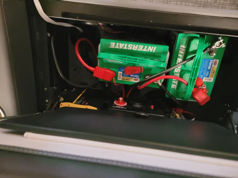 Slide: The Image of Battery compartment of 2023 Trifecta 24' SB2 ARCH SS 3 Plus with Interstate batteries. - 10