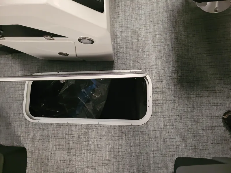 Slide: The Image of Open storage compartment on 2023 Trifecta 24' SB2 ARCH SS 3 Plus boat. - 16