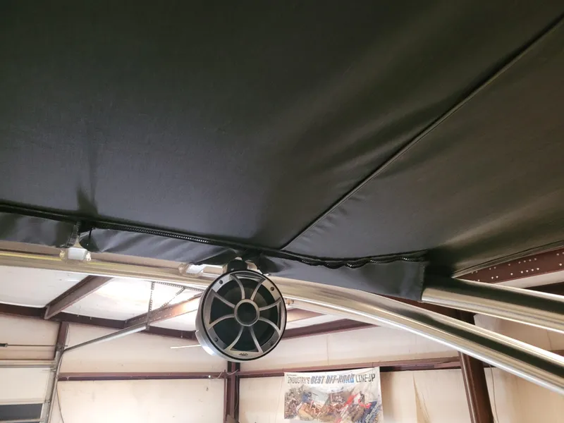 Slide: The Image of 2023 Trifecta 24' SB2 ARCH SS 3 Plus boat canopy and speaker detail. - 22