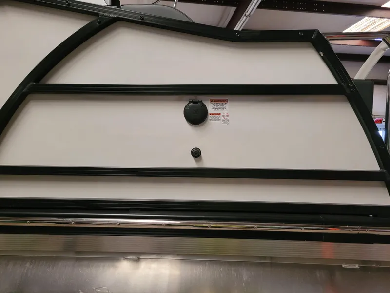 Slide: The Image of 2023 Trifecta 24' SB2 ARCH SS 3 Plus boat side view with sleek design. - 27