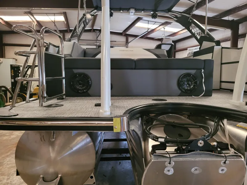 Slide: The Image of 2023 Trifecta 24' SB2 ARCH SS 3 Plus pontoon boat interior with seating and speakers. - 28