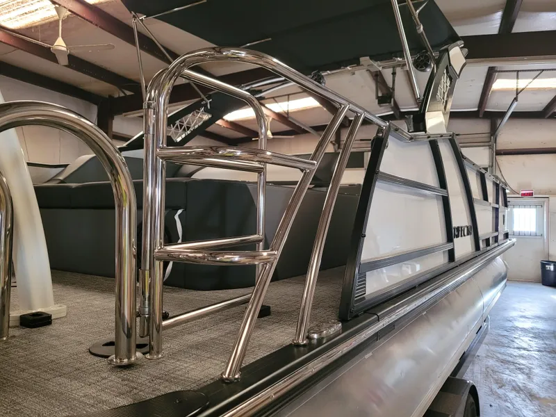 Slide: The Image of 2023 Trifecta 24' SB2 ARCH SS 3 Plus pontoon boat in a warehouse. - 29