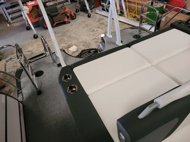 Slide: The Image of 2023 Trifecta 24' SB2 ARCH SS 3 Plus boat interior with seating and cup holders. - 6