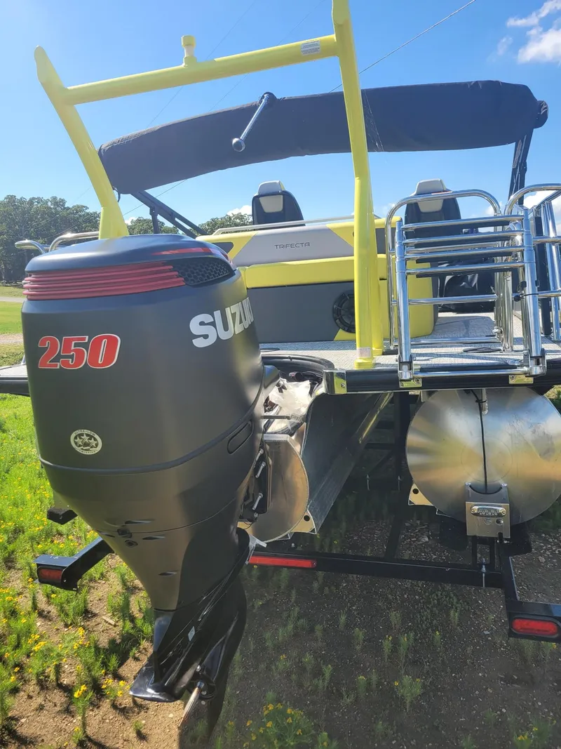 Slide: The Image of Trifecta 2023 23 UL SS pontoon boat with Suzuki 250 outboard motor, sunny day. - 12